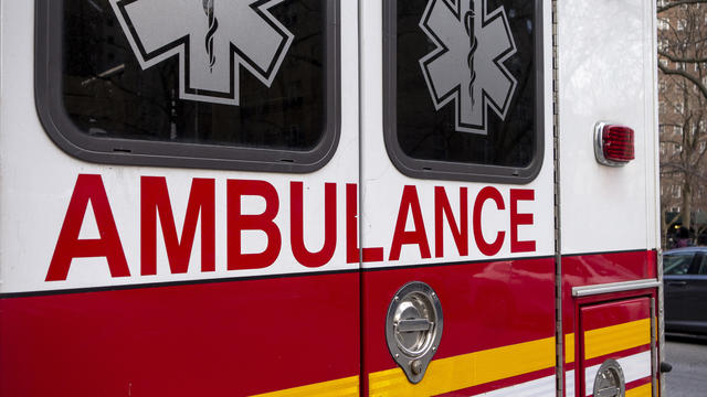 back of red white yellow ambulance 