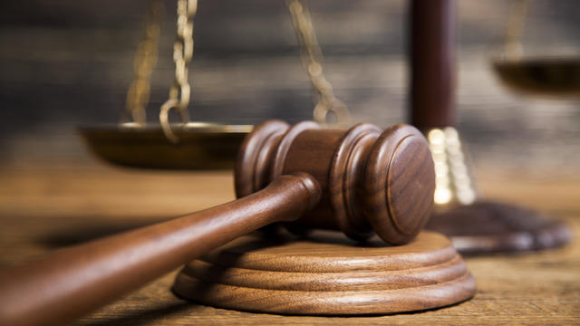 Mallet of the judge,Justice scale,Wooden desk background,Romania 